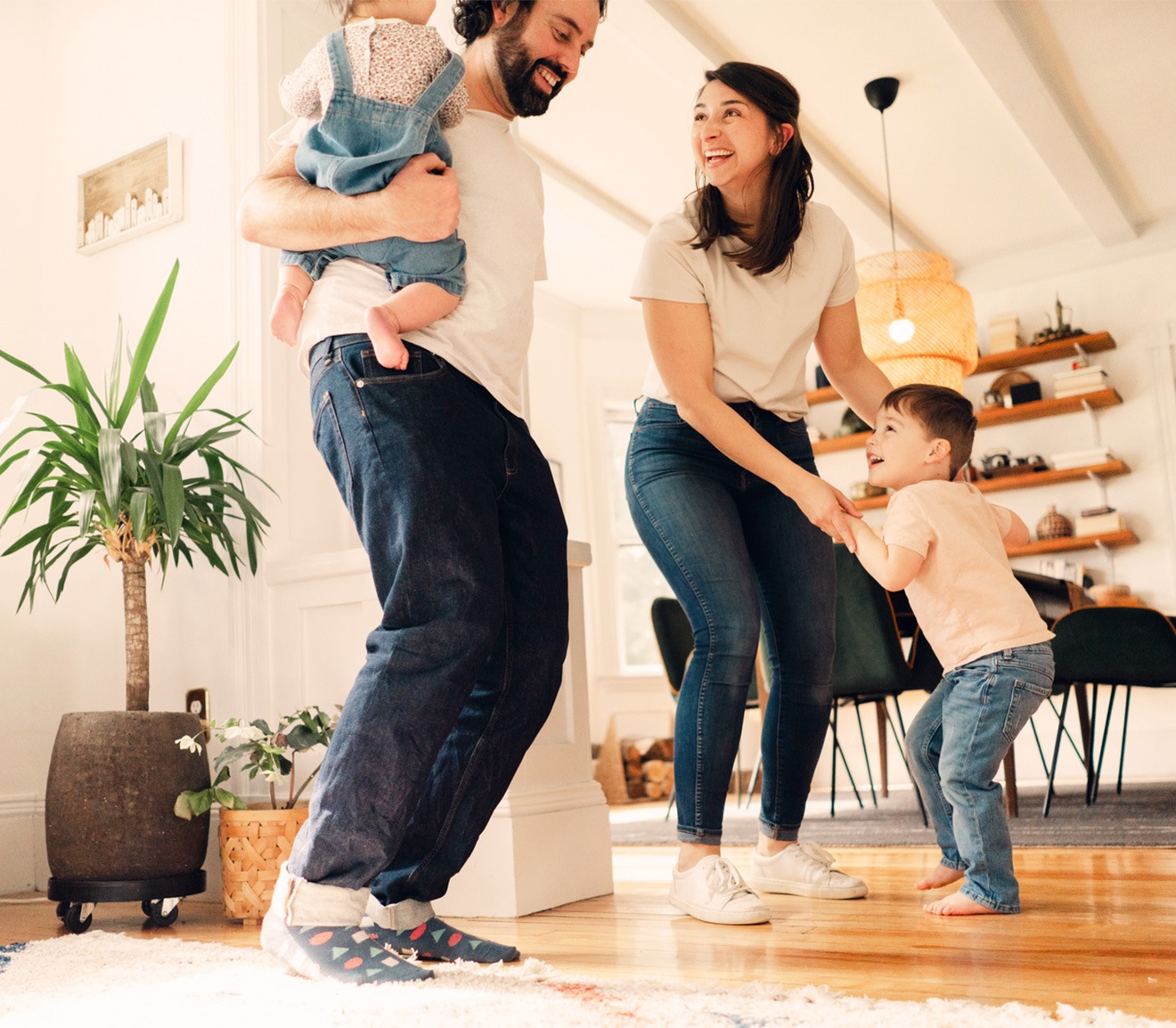 a familly of 4 dancing together